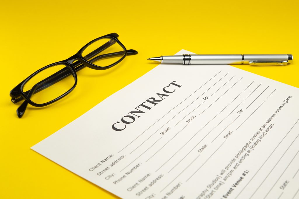 generic moving contract with eye glasses and a writing pen